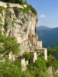 Low angle view of buildings against mountain