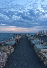 Scenic view of sea against cloudy sky