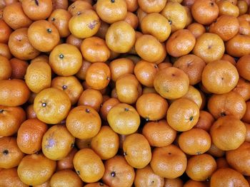 Full frame shot of oranges at market stall