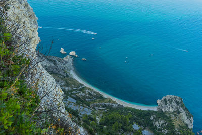 High angle view of rocks by sea