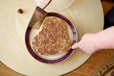 High angle view of person preparing food on table