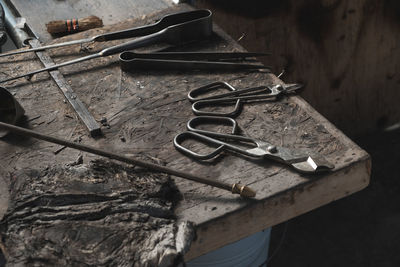 High angle view of hand tools on table in workshop