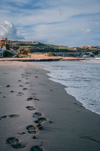 Scenic view of beach against sky