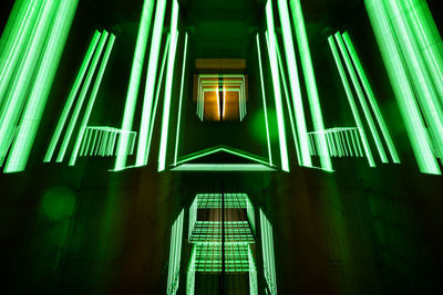 Low angle view of illuminated building at night