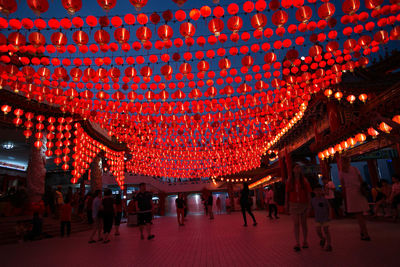 Group of people on red lantern at night