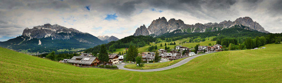 Panoramic view of houses and mountains against sky