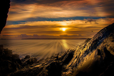 Scenic view of dramatic sky during sunset