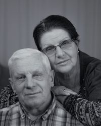 Portrait of smiling senior couple at home