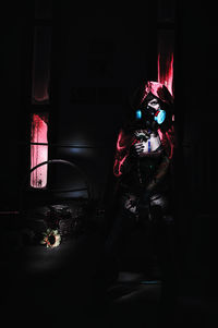 Man in illuminated room