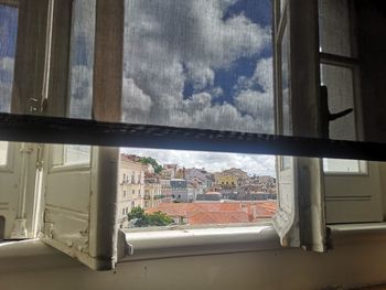 Buildings seen through glass window