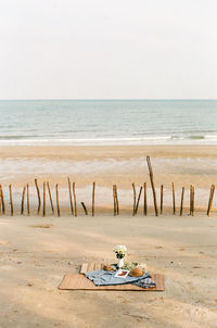 Scenic view of beach against clear sky