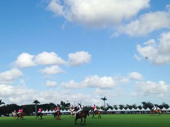 People on field against sky