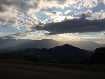 Scenic view of mountains against dramatic sky