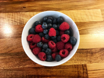 High angle view of strawberries in bowl on table