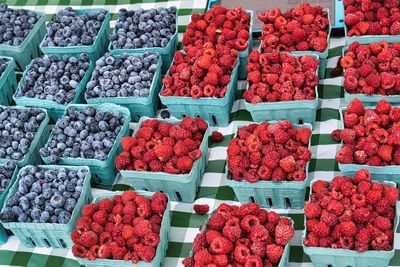 Blue berries and raspberries at farmer's market.