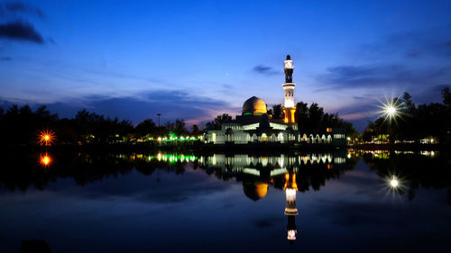 Scenic view of lake against sky at night