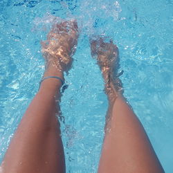 Low section of woman in swimming pool