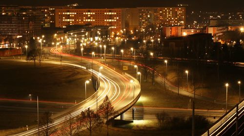 High angle view of light trails on road at night