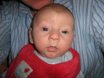 Close-up portrait of baby boy at home