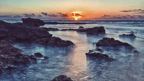 Scenic view of sea at sunset