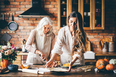 Female friends sitting on table