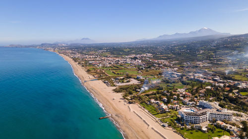 High angle view of sea and buildings against sky