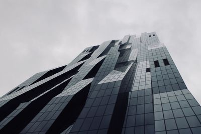 Low angle view of office building against sky