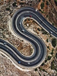 Aerial view of vehicles on winding road