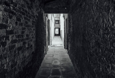 Empty corridor along buildings venice italy