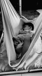 Boy sleeping sitting on floor