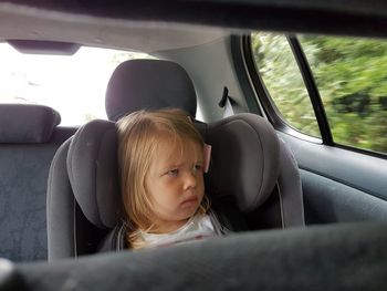 Boy sitting in car