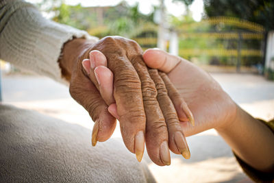 Close-up of person hand holding outdoors