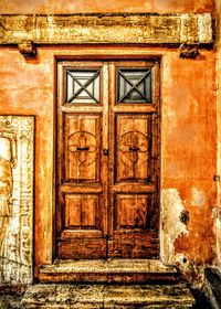 Closed wooden door of house