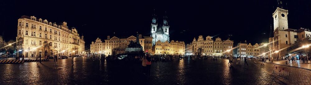 Panoramic view of city buildings at night