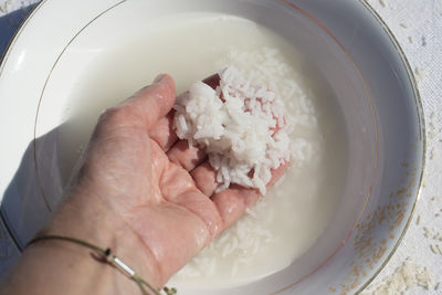 Cropped hand of person washing hands