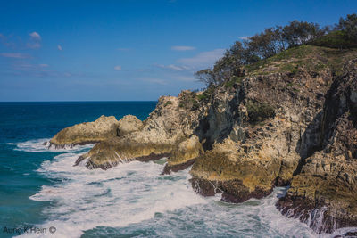 Scenic view of sea against blue sky