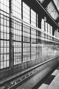 Railroad station platform seen through train window