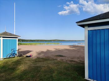 Beach hut against sky