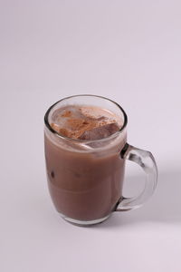 Close-up of coffee cup against white background