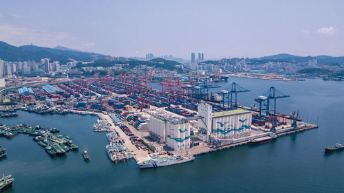 High angle view of harbor by sea against sky