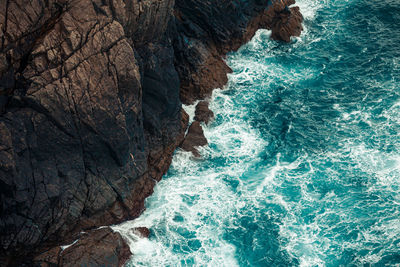 High angle view of rock formation in sea