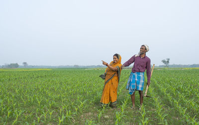 Full length of woman on field against sky