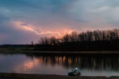 Idyllic view of lightning at lakeside