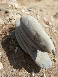 High angle view of stacked pebbles at beach