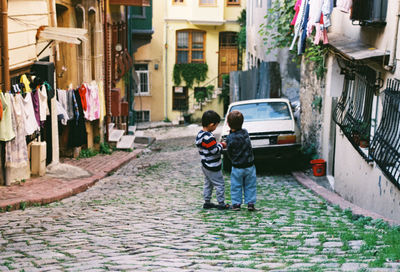 Two children playing on the street