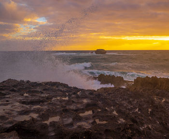 Scenic view of sea against sky during sunset