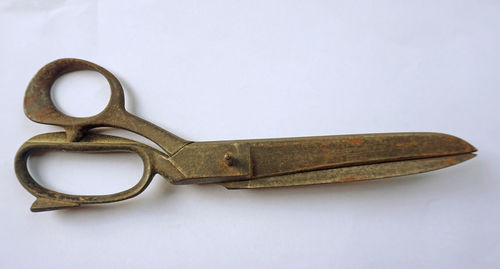 High angle view of rusty metal against white background