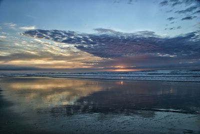 Scenic view of sea against sky at sunset
