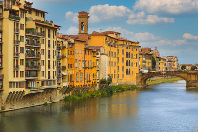 Houses and carraia bridge on arno river, florence,italy 