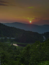 Scenic view of landscape against sky during sunset